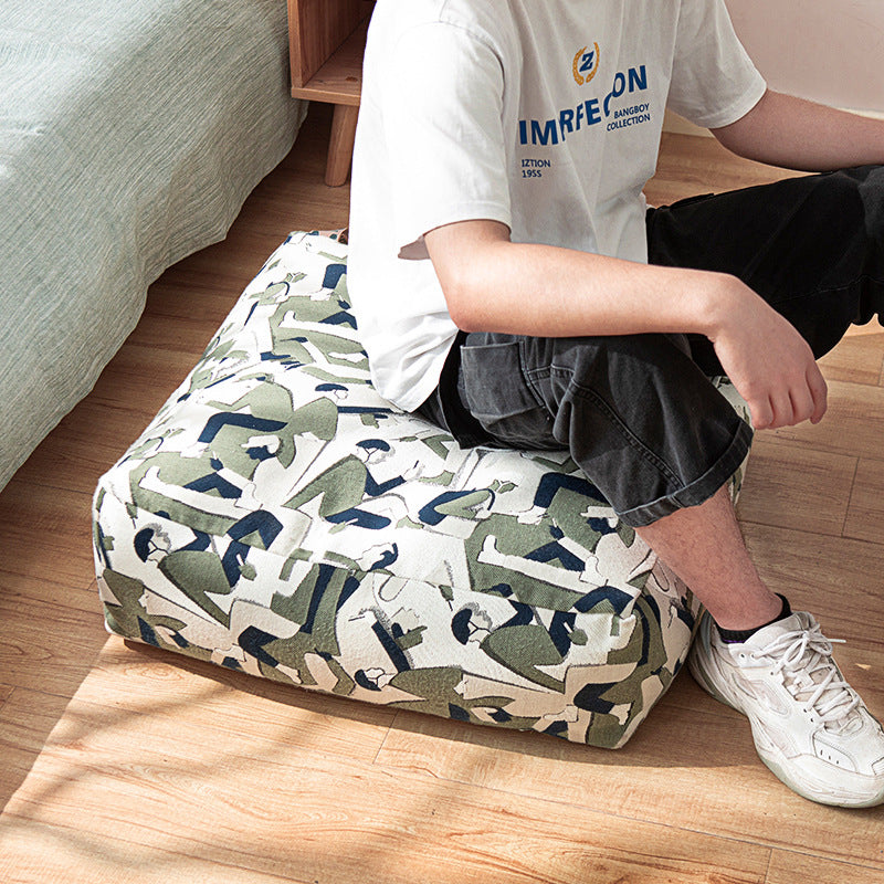 Seating pouf made of woven cotton blend with quilted diamond relief Stornfield