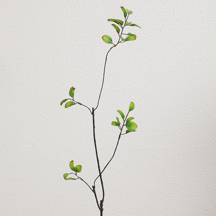Artificial flower branch with vibrant orange flowers
