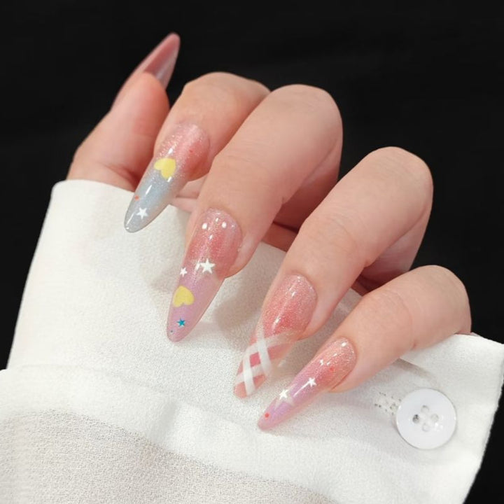 Playful artificial nails with glitter and colorful patterns Stornfield