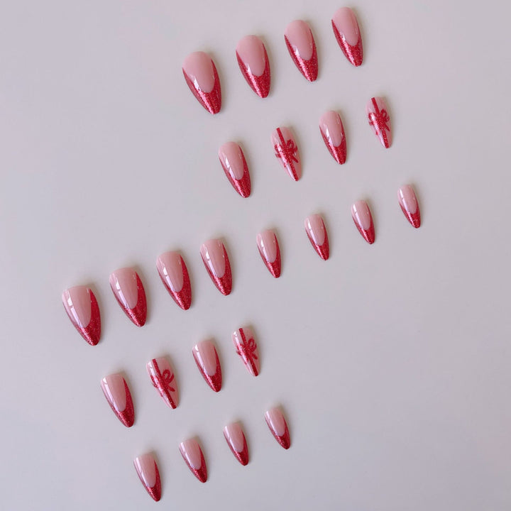 Nail set with glamorous glitter accents and bow design Stornfield