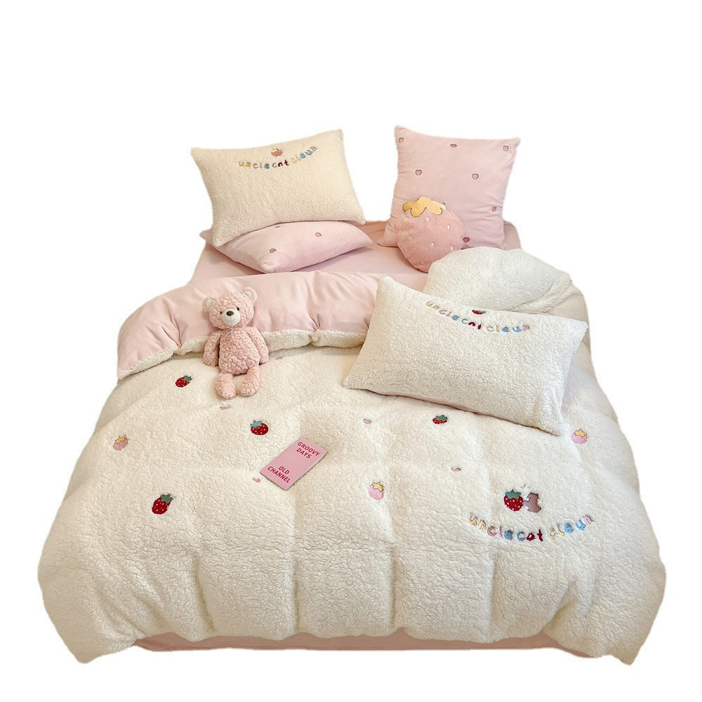 Plush quilt with teddy fleece, embroidered strawberry appliqués and reversible function