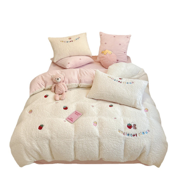 Plush quilt with teddy fleece, embroidered strawberry appliqués and reversible function
