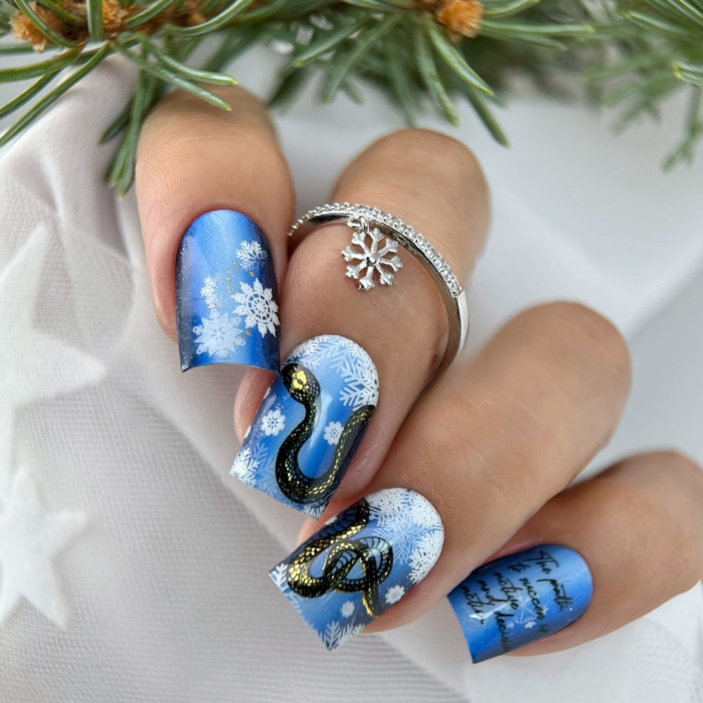 Creative art nails with snowflake and snake motif Stornfield