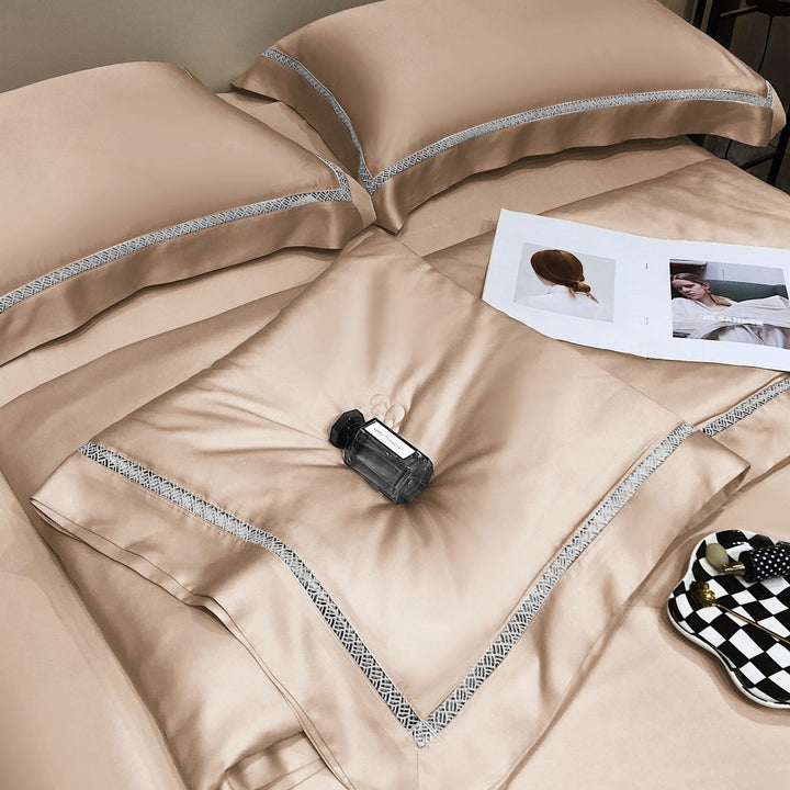 Luxurious satin bedding set with fine embroidered border and tone-on-tone floral relief