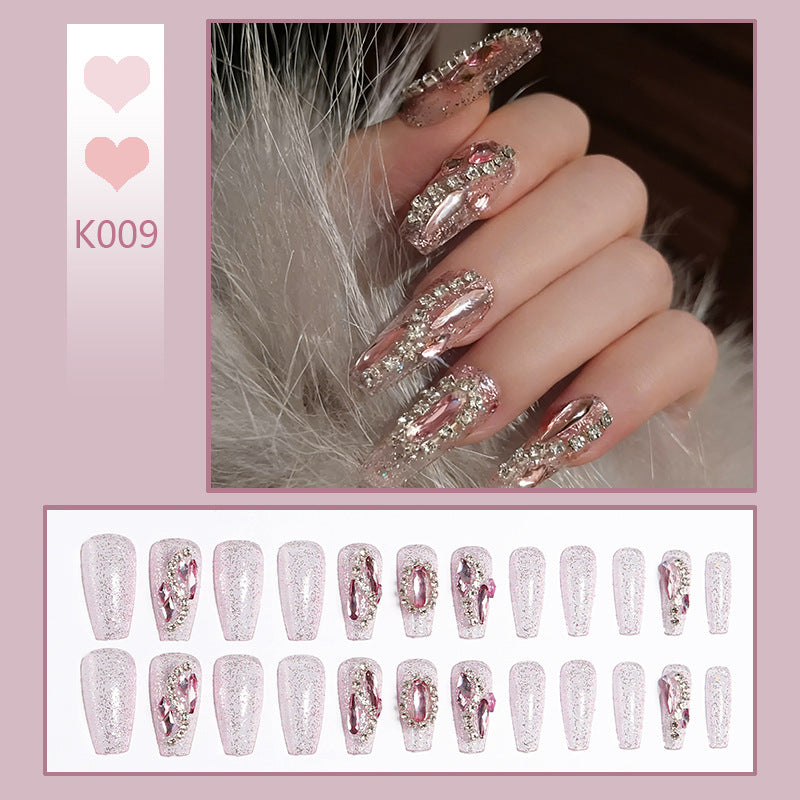Glamorous artificial nails with sparkling rhinestone decorations Stornfield