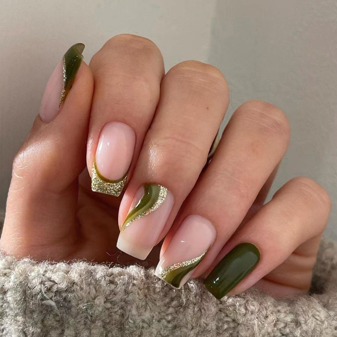 Artful nail extensions with golden accents and elegant design Stornfield