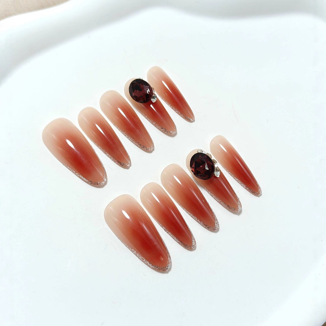Glittering artificial nails with elegant tip design and crystal decoration Stornfield