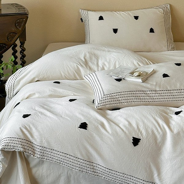 Linen-cotton blend duvet cover set with embroidered accent motifs and striped border