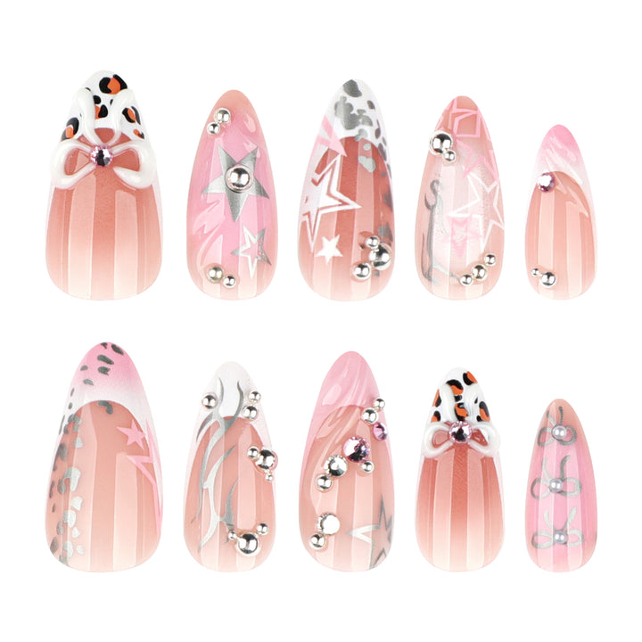 Artful stiletto nails with glitter and bow decorations Stornfield