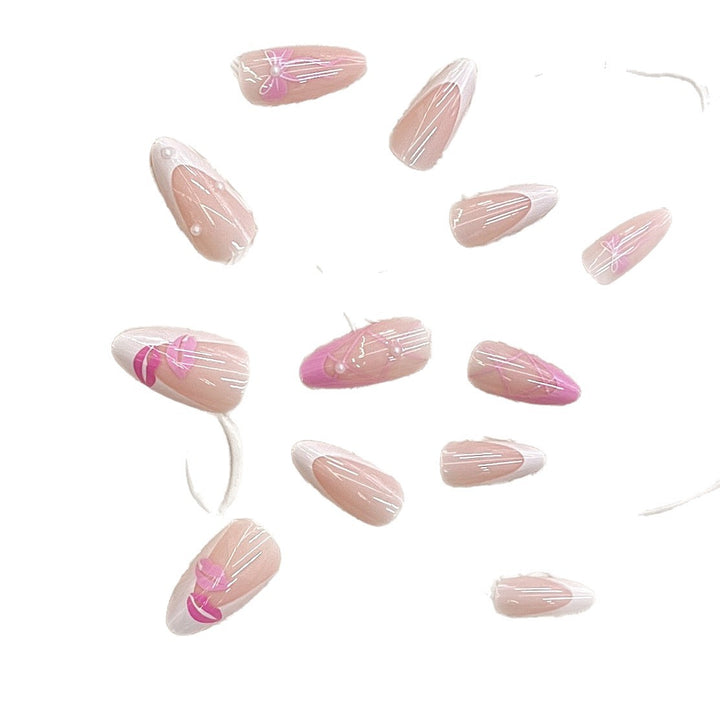 Artistic Press-On Nail Set with Kiss and Bow Design Stornfield