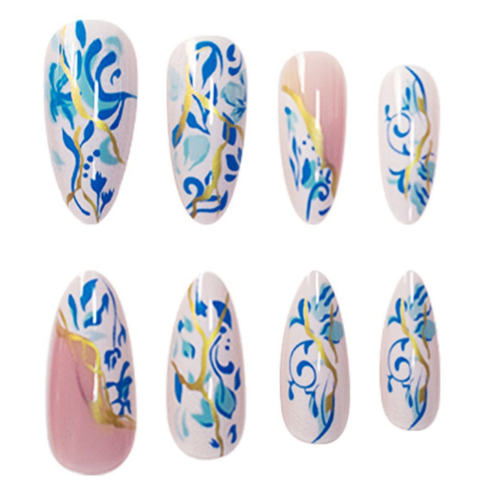 Artistic Floral Press-On Nail Design with Gold Accents Stornfield