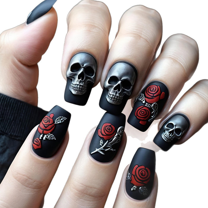 Creative nail art with skull and rose designs Stornfield