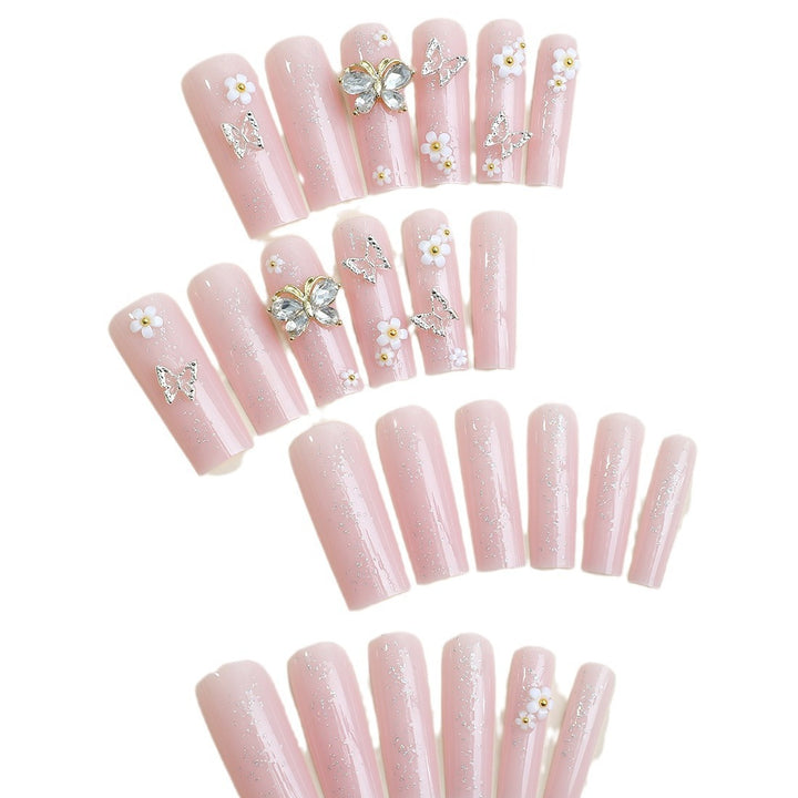 Artificial nail set with floral and glittering accents Stornfield