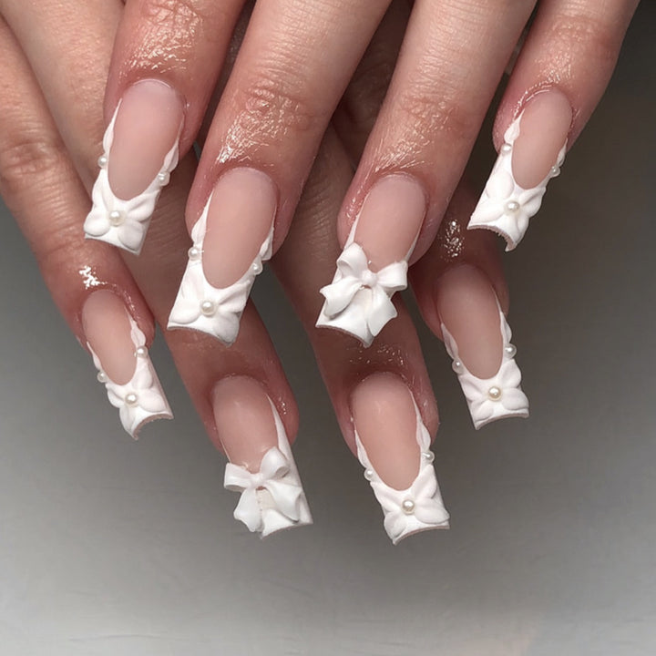 Artificial nail art with ribbon decoration Stornfield