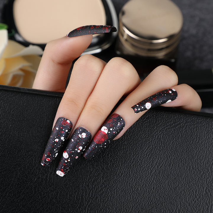 Artistic splatter design artificial nails Stornfield