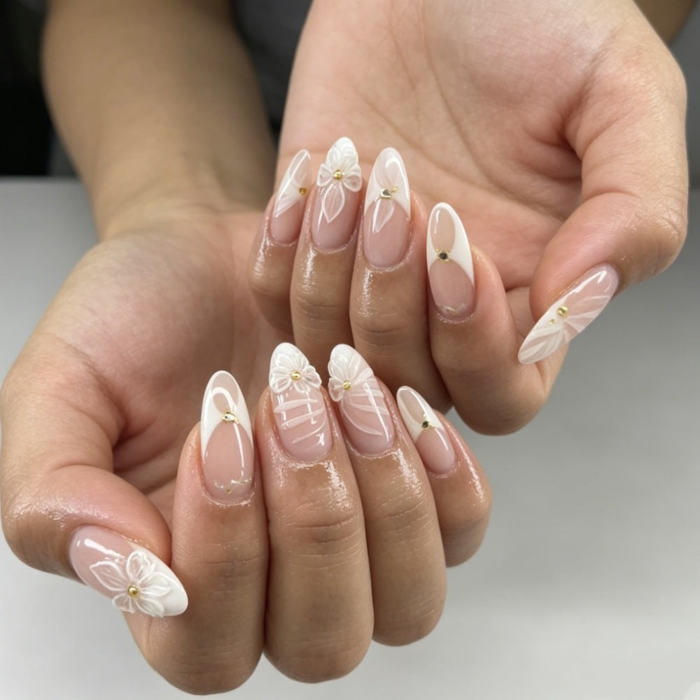 Artificial nails with elegant flower design and glitter accents Stornfield