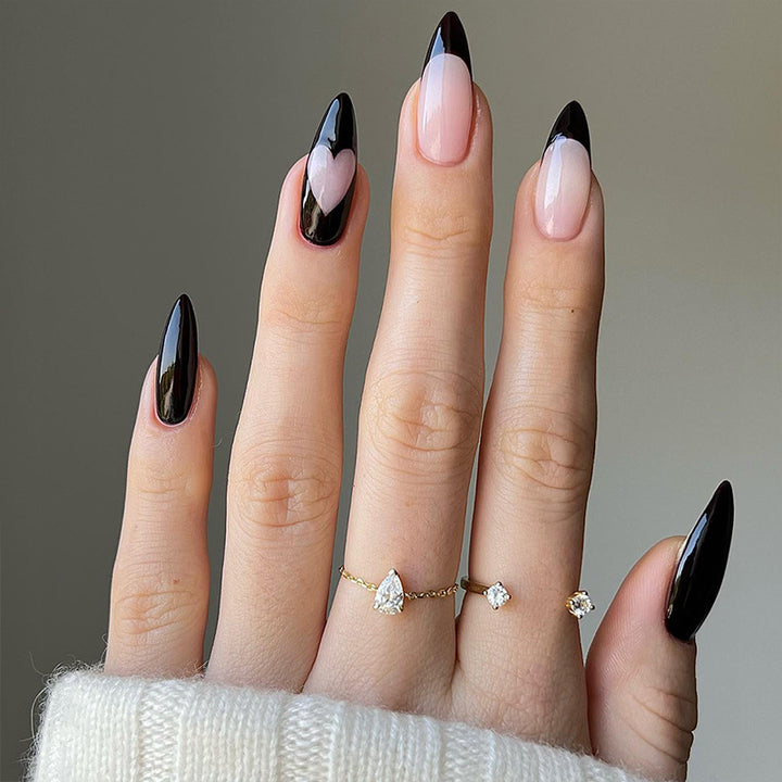 Artful stiletto nails with heart-shaped accents Stornfield