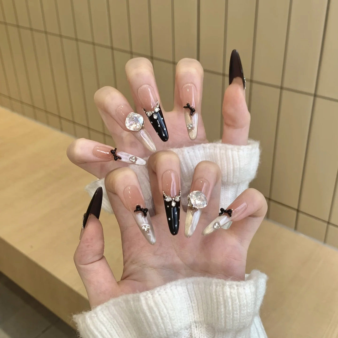 Artistic Stiletto Press-On Nail Art with Glimmering Accents Stornfield