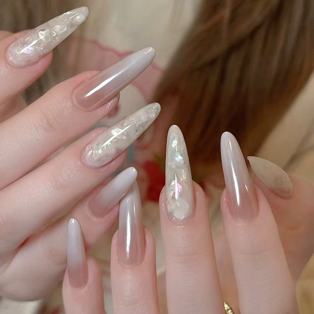 Glamorous Stiletto Nail Extensions with Decorative Accents