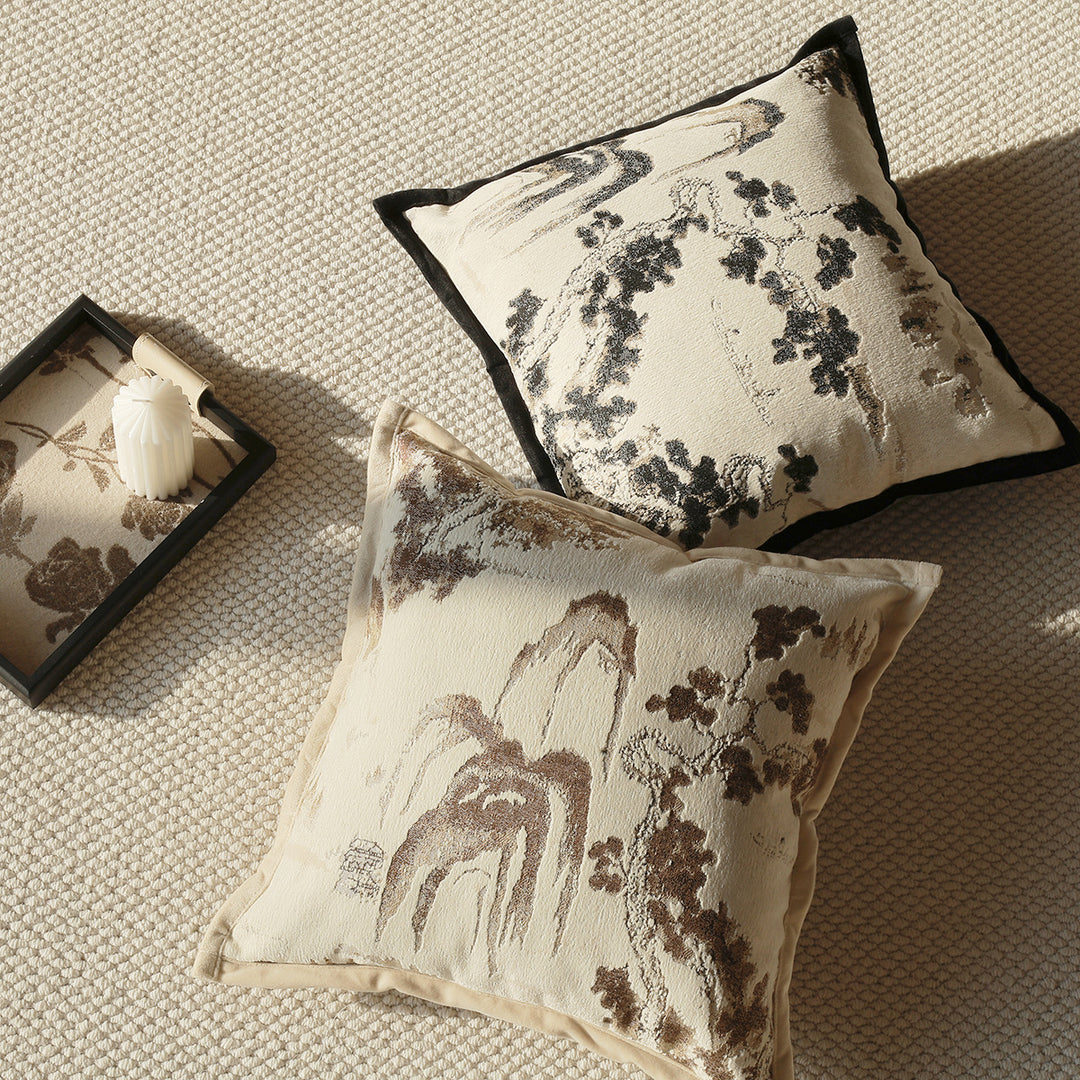 Elegant decorative pillow with intricate landscape illustration