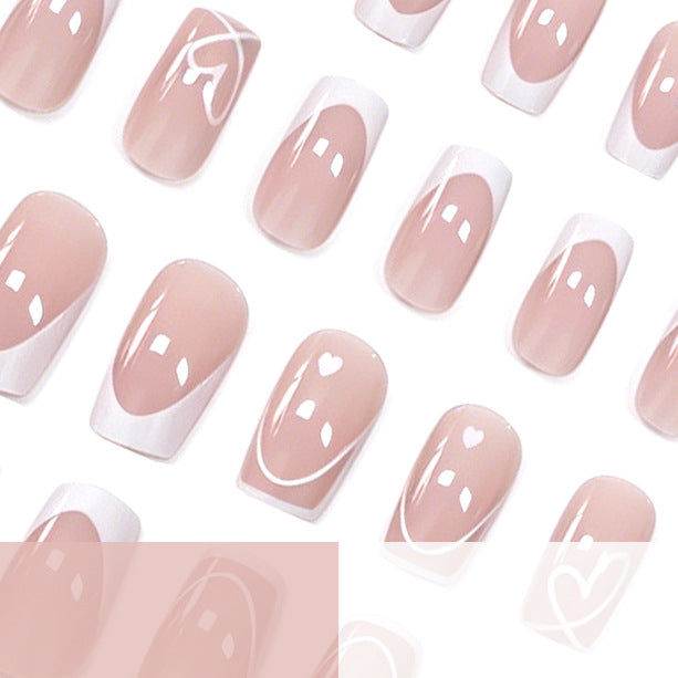Heart-Embellished French Tip Nail Art Stornfield