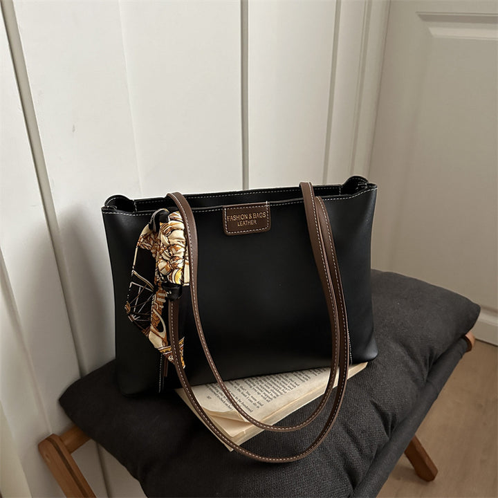 Elegant Leather Tote Bag with Decorative Scarf