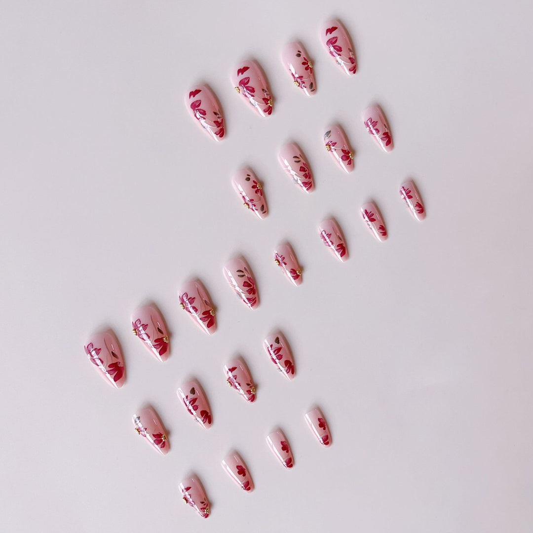 Artificial nail set with floral patterns and golden accents Stornfield
