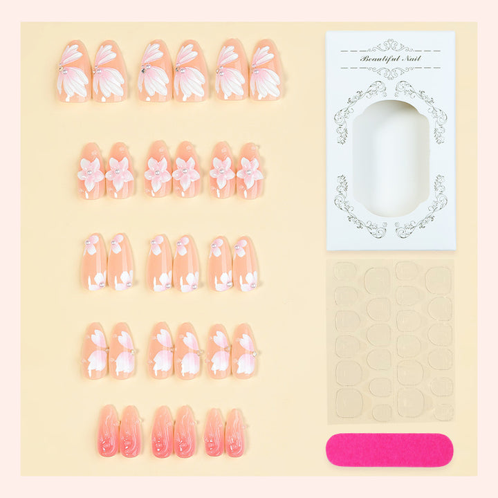 Artificial nail set with floral motifs and rhinestone decorations Stornfield