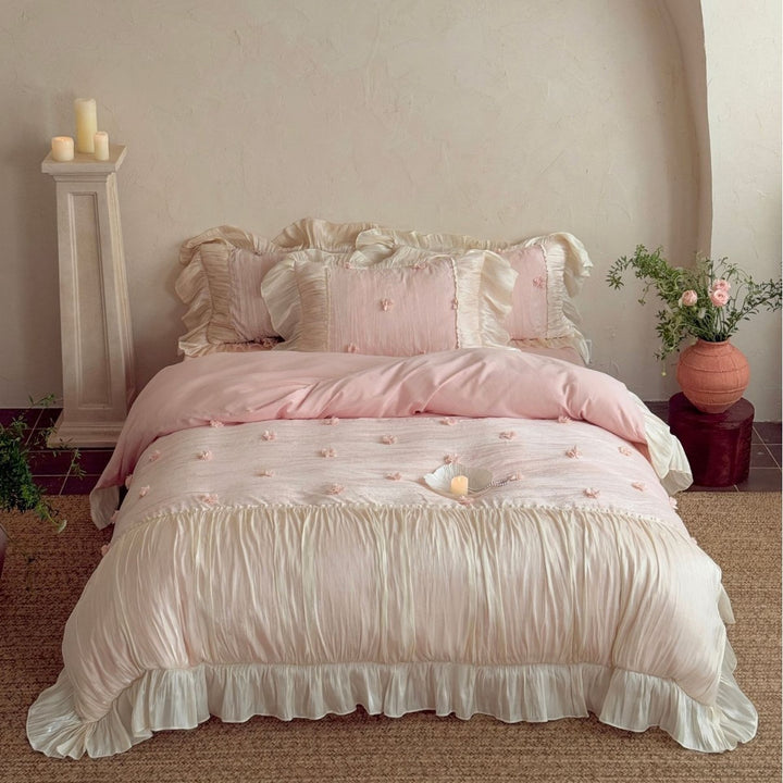 Satin look quilted bedspread with pleated ruffle and 3D flower appliqué