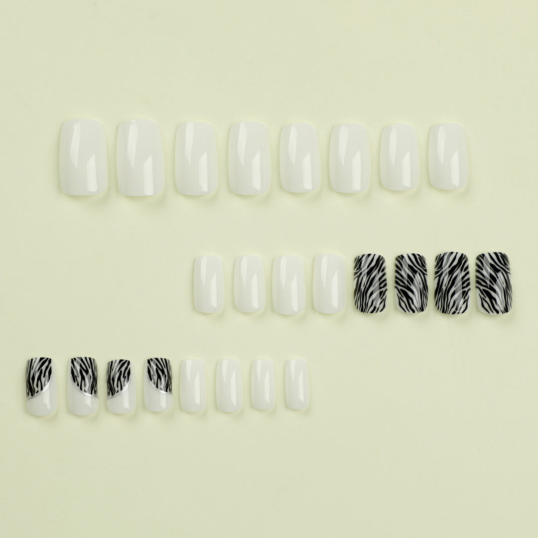 Artful nail extensions with stylish zebra pattern Stornfield