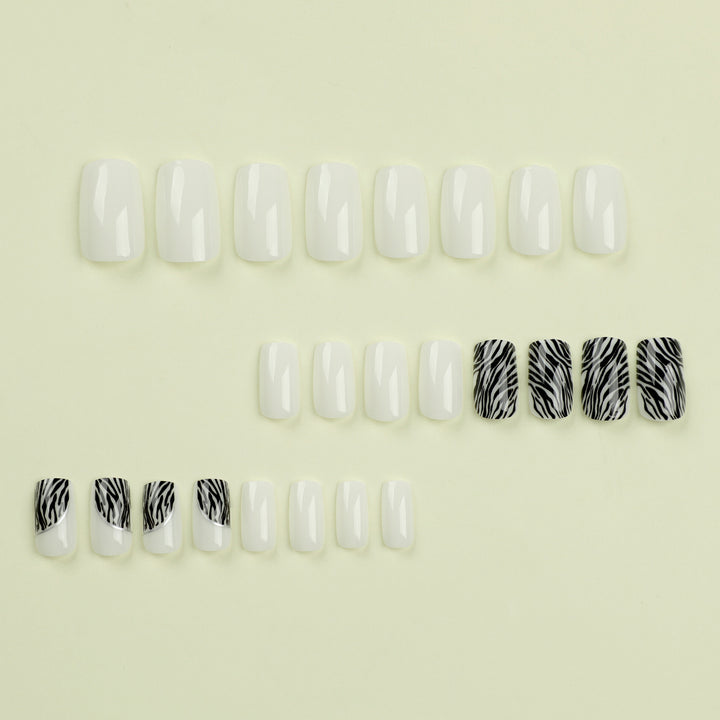 Artful nail extensions with stylish zebra pattern Stornfield