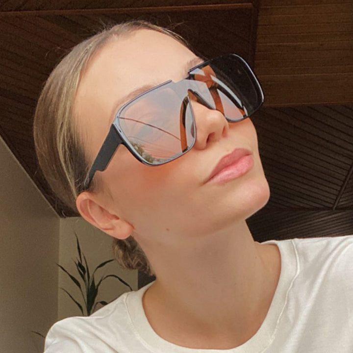 Ladies trendy square sunglasses with transparent green frame and protective UV filter Stornfield