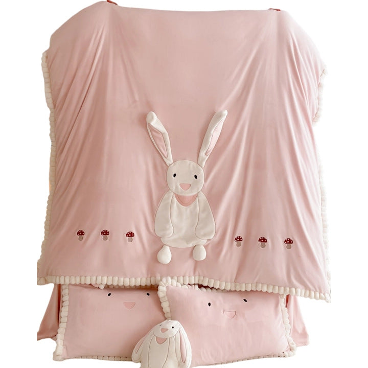 Cozy quilted bedding set with plush appliqué and pompom trim