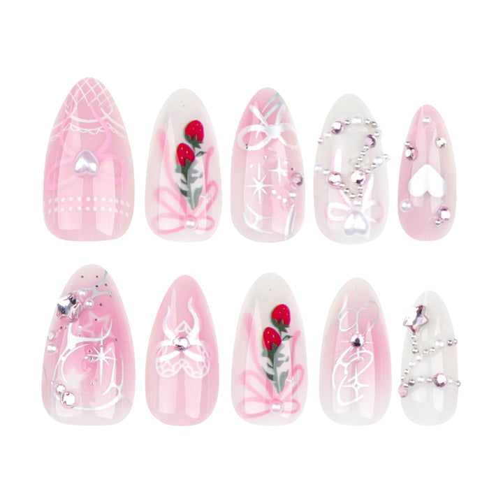 Artificial nail art with romantic design and glitter accents Stornfield