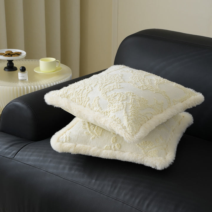 Square decorative pillow with embossed circular relief and soft faux fur edging