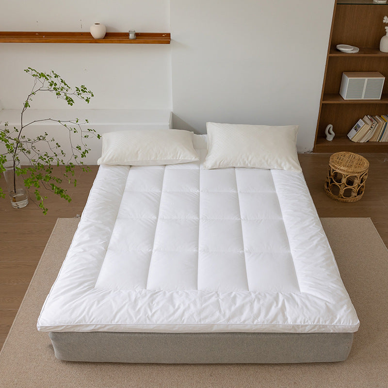 Padded mattress topper with a light down look and breathable hollow fiber filling