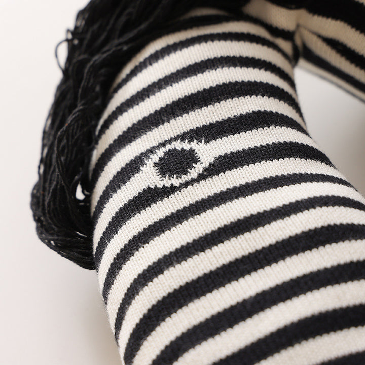 Striped decorative knitted cushion in animal shape with fringes and four-legged look Stornfield