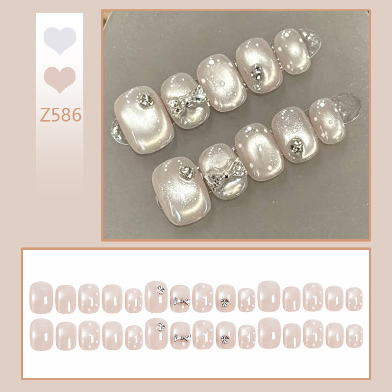 Artificial nail set with elegant glitter and crystal decorations Stornfield