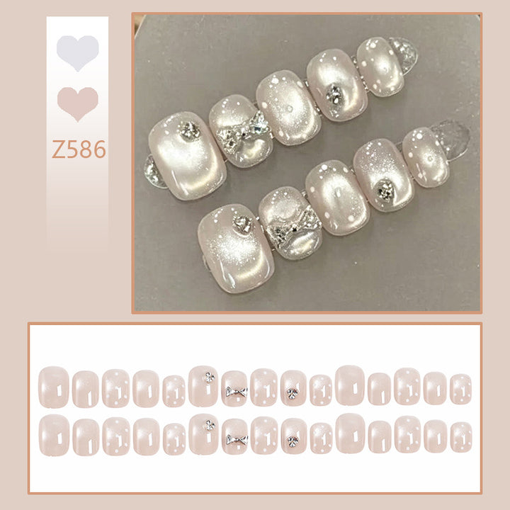 Artificial nail set with elegant glitter and crystal decorations Stornfield