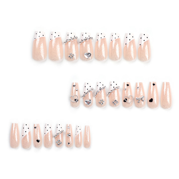 Artful nail extensions with elegant rhinestone and heart designs Stornfield