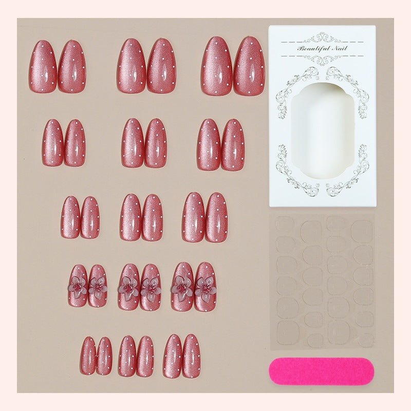 Artificial nail set with glamorous glitter design and floral accent Stornfield