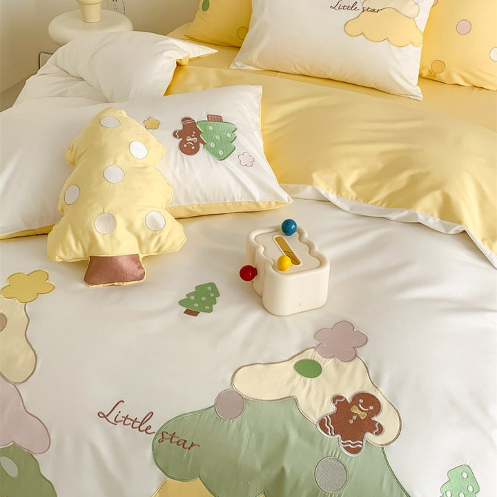 Children's bedding set with playful tree appliqués and soft pillowcases