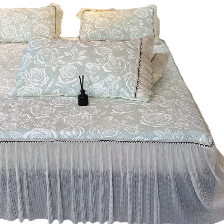 Quilted mattress and pillow set with butterfly motif and pleated bed ruffle