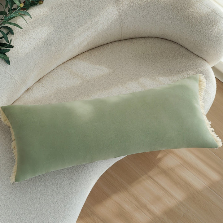 Long decorative cushion with fringe edge