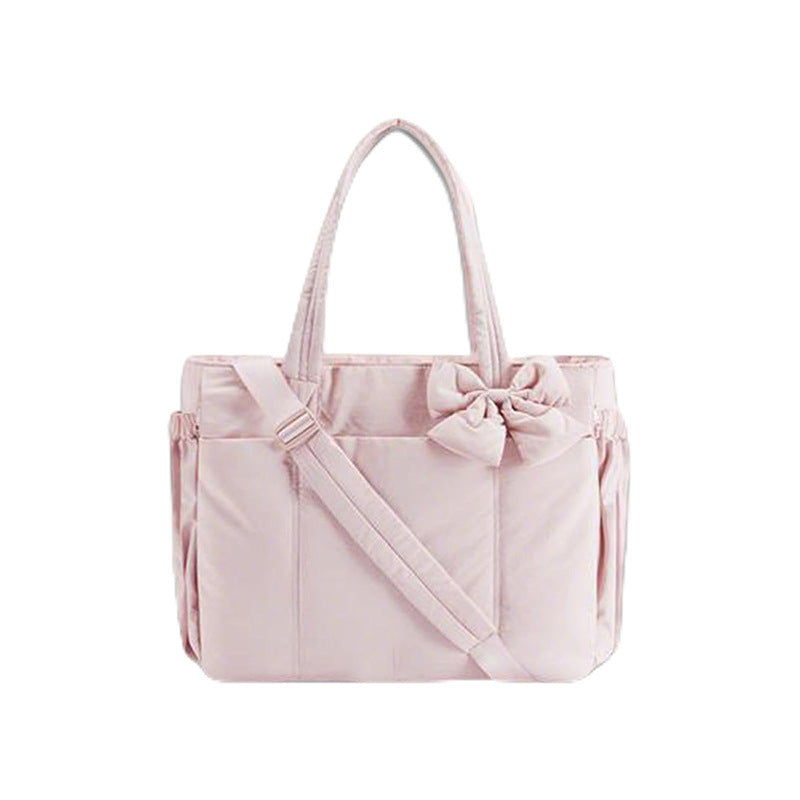 Multifunctional tote bag with detachable shoulder straps and decorative bow Stornfield