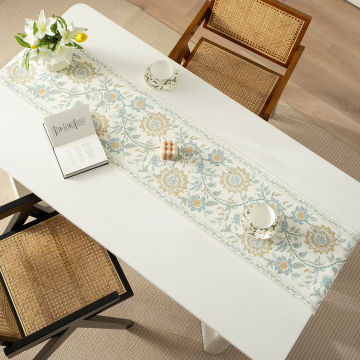 Woven decorative table runner with floral medallion borders and fringes Stornfield