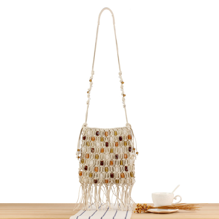 Hand-knotted shoulder bag with decorative beads and fringes Stornfield