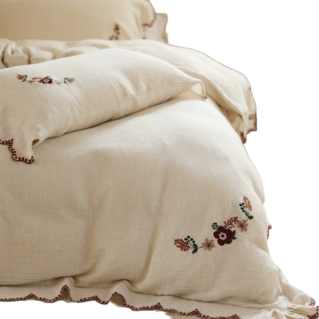Embroidered cotton muslin bedding set with frill and floral embroidery