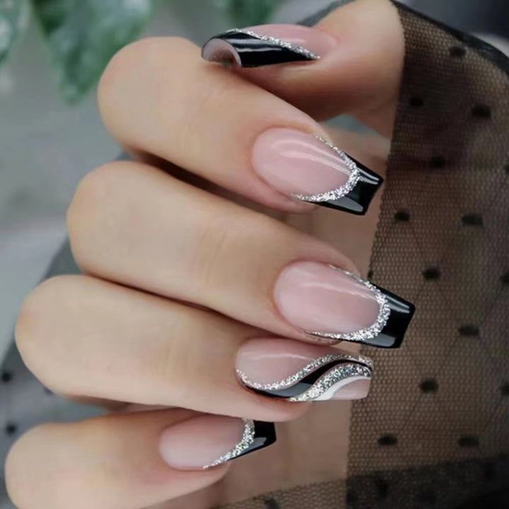 Elegant nail design with bow and rhinestone details Stornfield