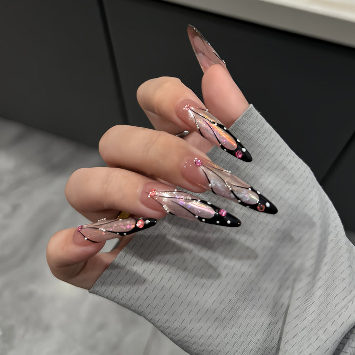 Artifical nail tips with elegant designs and glitter accents Stornfield